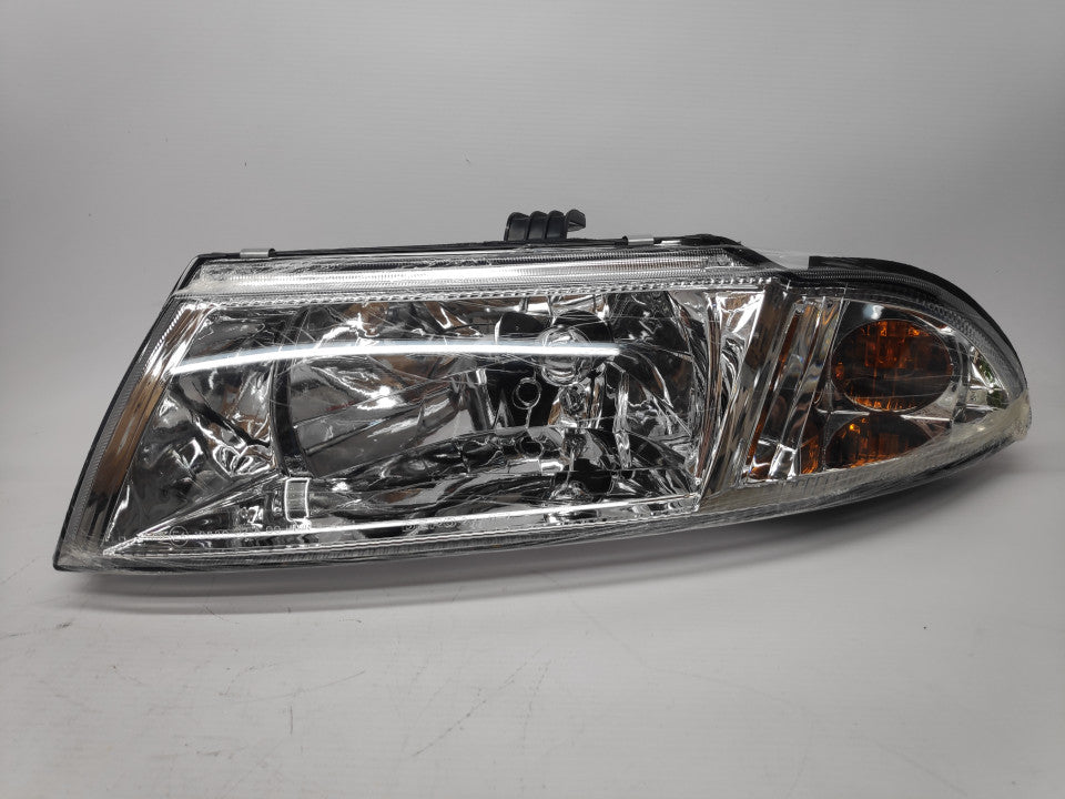 Farol Esquerdo Mitsubishi Carisma 99-05